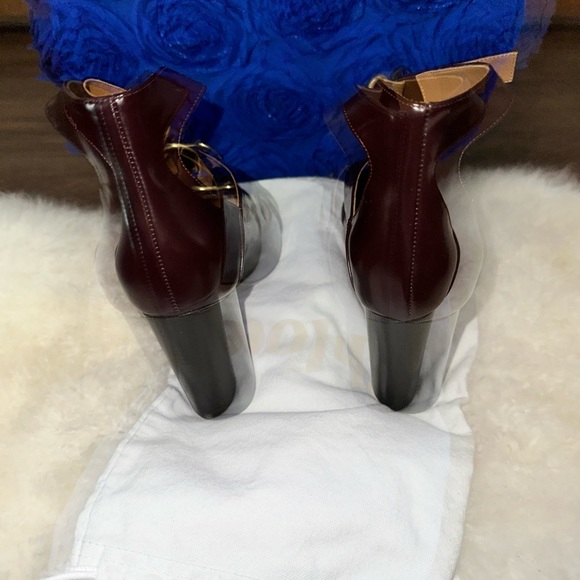 - [ ] Burgundy leather Chloé round-toe pumps with brass hardware, stacked heel - Picture 4 of 8